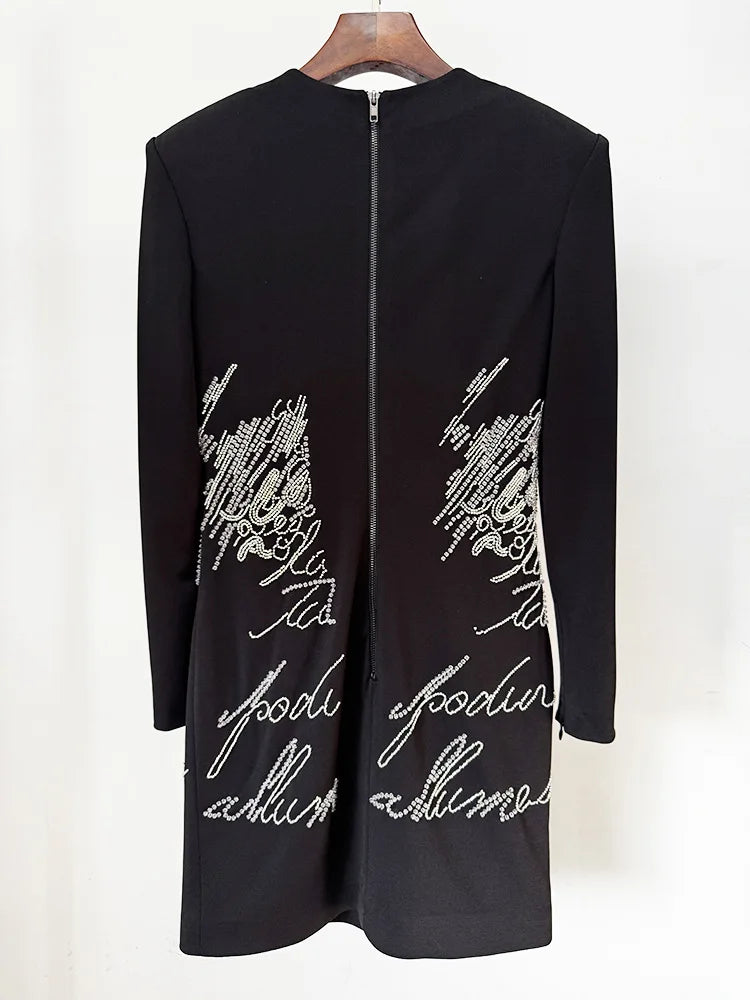 Back view of black beaded script long sleeve mini dress