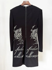 Back view of black beaded script long sleeve mini dress