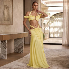 Yellow halter ruffle crop top and cutout maxi skirt