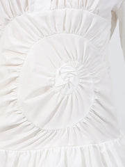 Close-up of a white textured fabric with a circular pattern