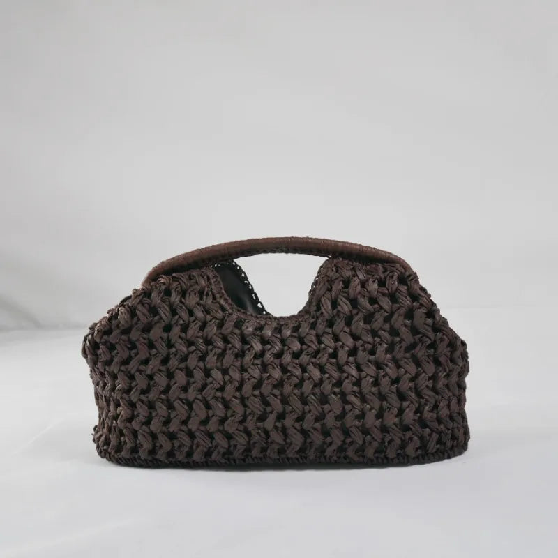 Summer beach tote bag with raffia texture and curved silhouette