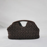 Summer beach tote bag with raffia texture and curved silhouette
