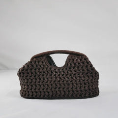 Summer beach tote bag with raffia texture and curved silhouette