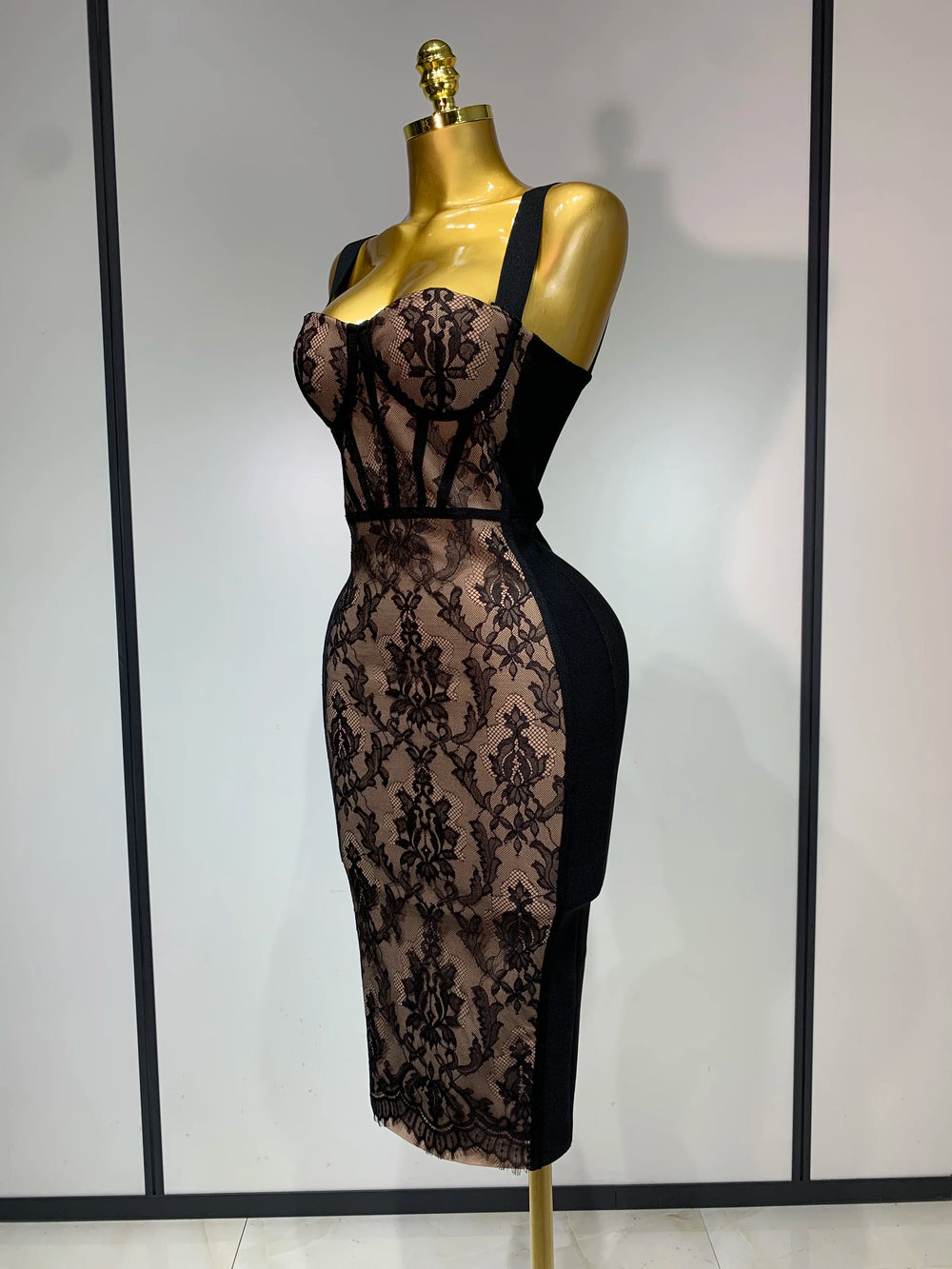 Side view of sleeveless V-neck lace overlay bodycon midi dress
