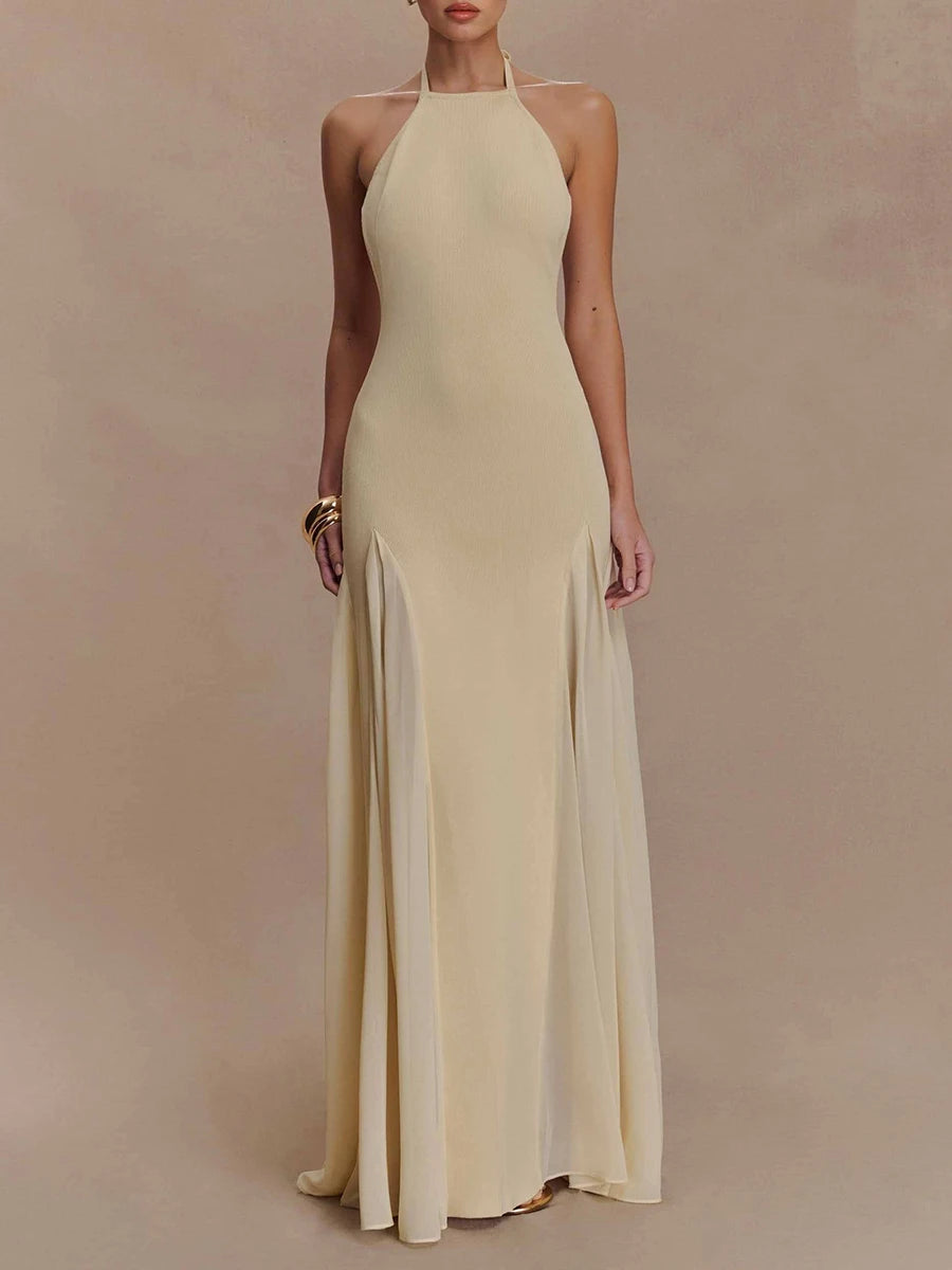 Halter neck a-line maxi dress with pleated skirt and back tie detail.