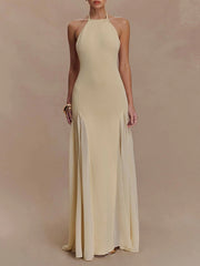 Halter neck a-line maxi dress with pleated skirt and back tie detail.