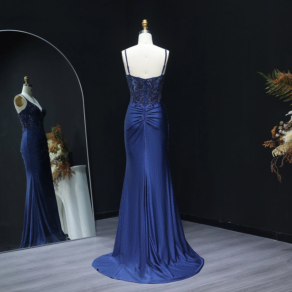 Blue evening gown on a mannequin against a dark background