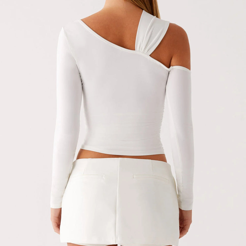 White long-sleeve top with cut-out design on a plain background