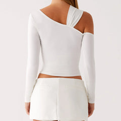 White long-sleeve top with cut-out design on a plain background