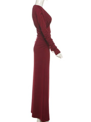 Maroon evening gown on a mannequin against a white background