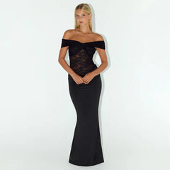 Woman wearing a black off-shoulder dress against a white background