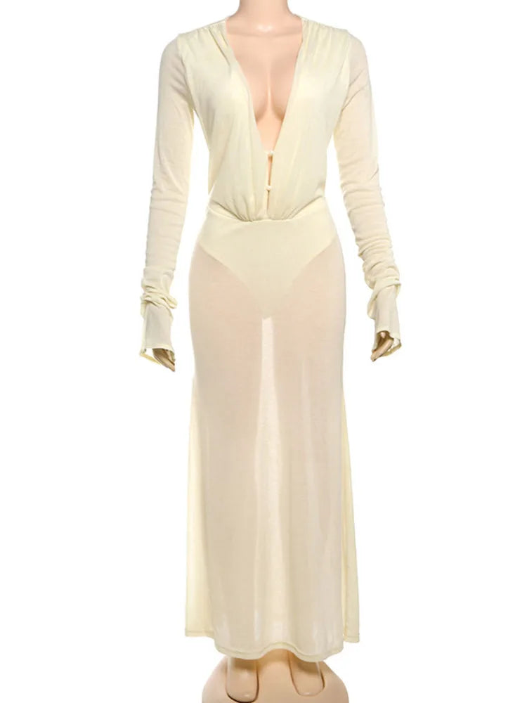 Cream-colored dress with long sleeves on a mannequin against a white background