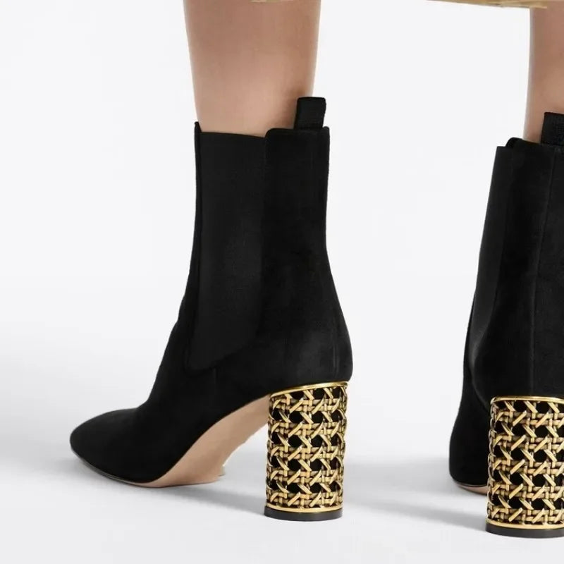 Black suede ankle boot with a hollow-out gold heel