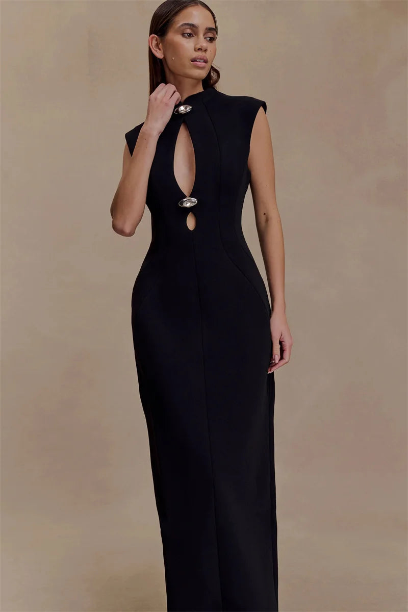 Woman wearing a black sleeveless dress with cut-out design on a beige background