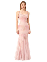 Model wearing a spaghetti strap lace trim fishtail tulle gown in a soft pink hue.