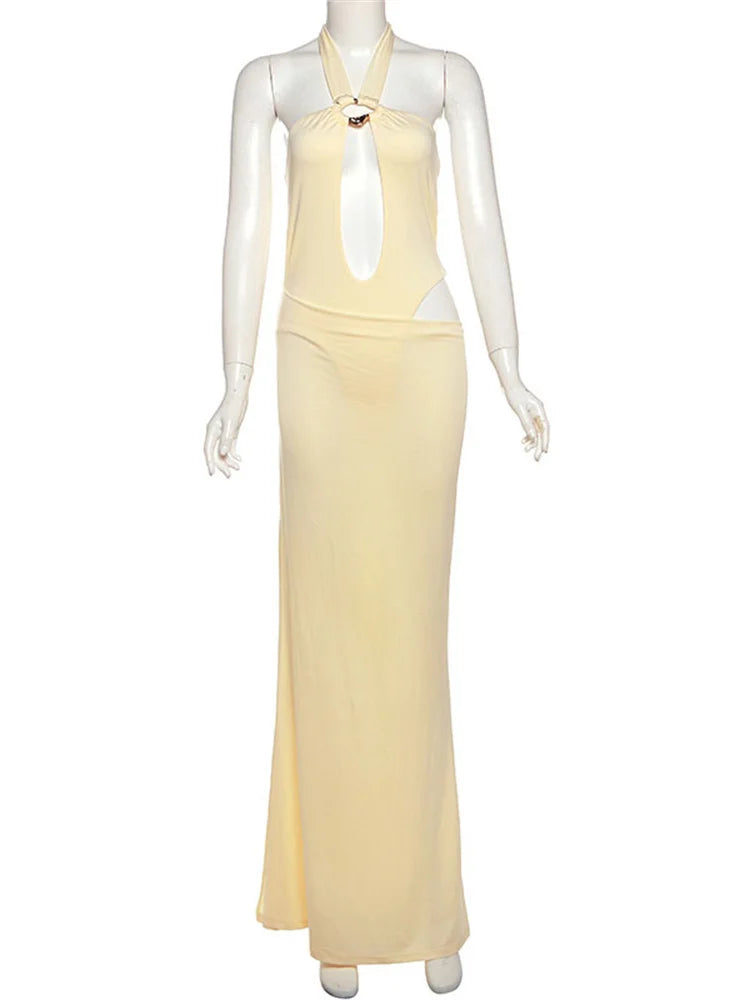 Mannequin wearing a yellow halter neck dress on a white background