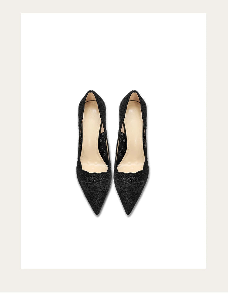 Pair of black high-heeled shoes on a white background