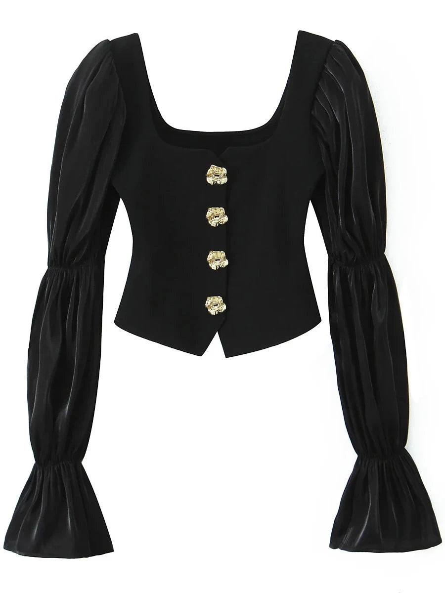 Black corset top with gold buttons on a white background