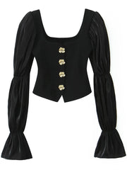 Black corset top with gold buttons on a white background