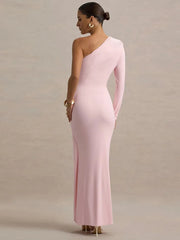Woman wearing a pink one-shoulder gown against a plain background