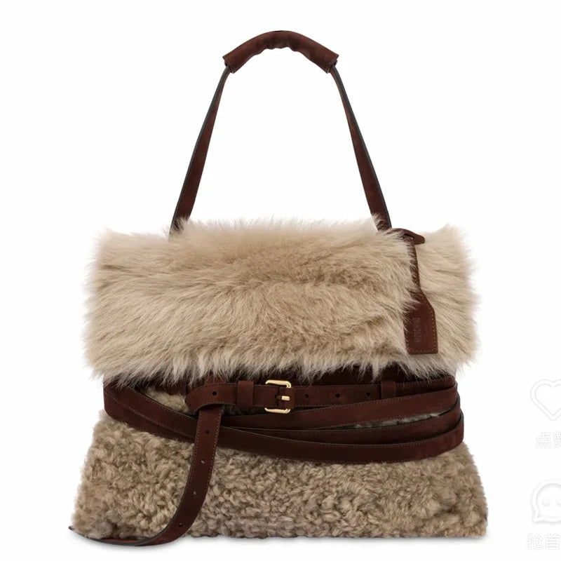 Front view of the plush fur belted messenger bag.