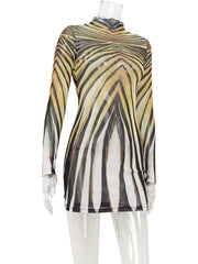 Zebra-striped long-sleeve top on a mannequin against a white background