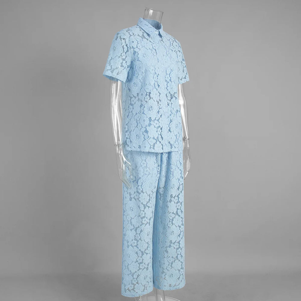 Light blue lace outfit on a mannequin against a gray background