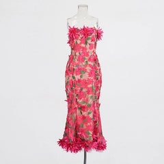 Pink floral dress on a mannequin against a white background