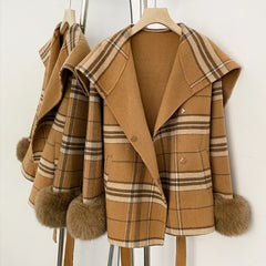 Detail of the belt and buttons on a Khaki Plaid coat