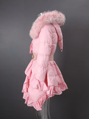 Pink puffer coat with fur hood on a dark background