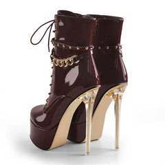 Rear view of patent leather lace-up platform ankle boots showcasing the clear stiletto heel.
