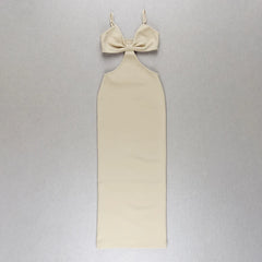 Beige dress with a bow detail on a gray background