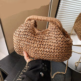 Woven handbag held by a person