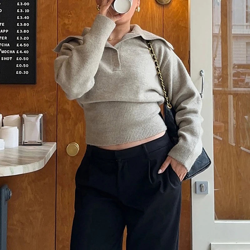 Detail shot of sweater hem and soft knit texture with gentle drape