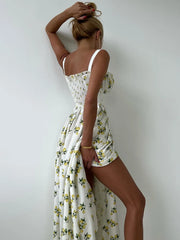 Woman wearing a floral dress against a white background