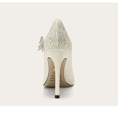 White high-heeled shoe with crystal embellishments on a light gray background