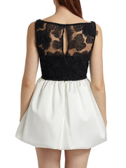 Black lace top and white skirt dress on a white background