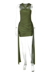 Green dress on a mannequin against a white background
