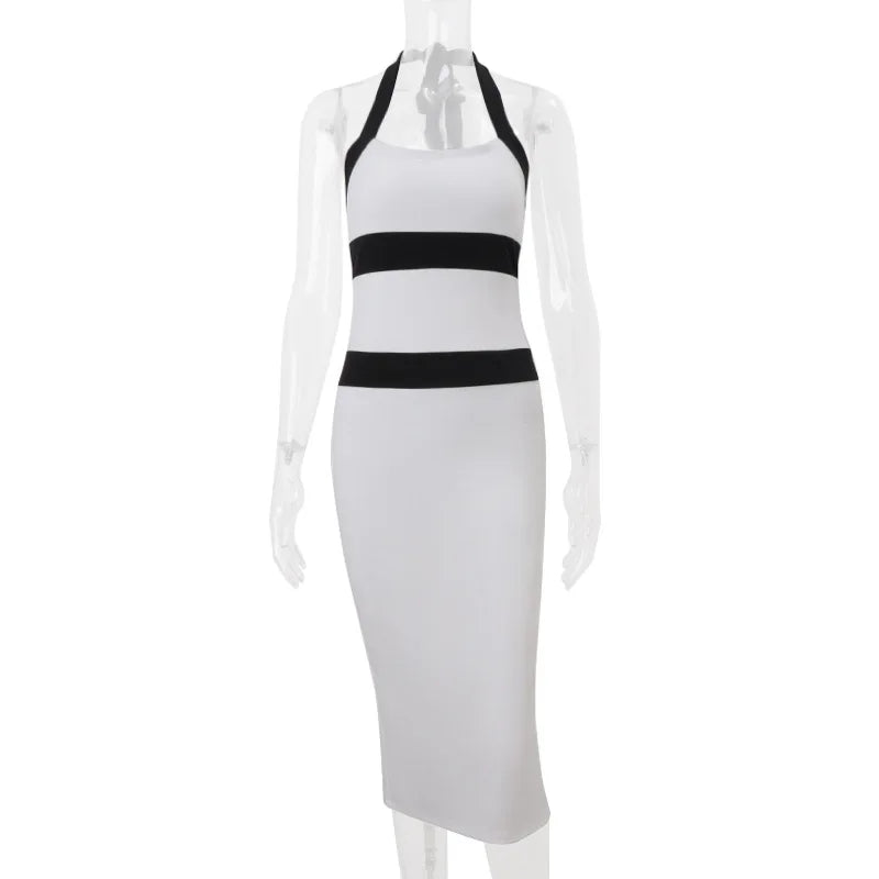White halter neck dress with black stripes on a mannequin