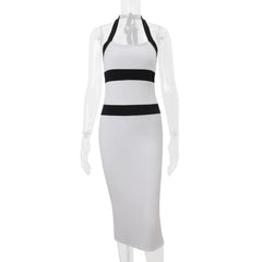 White halter neck dress with black stripes on a mannequin