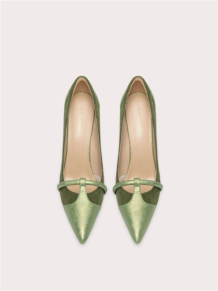Pair of green high-heeled shoes on a white background