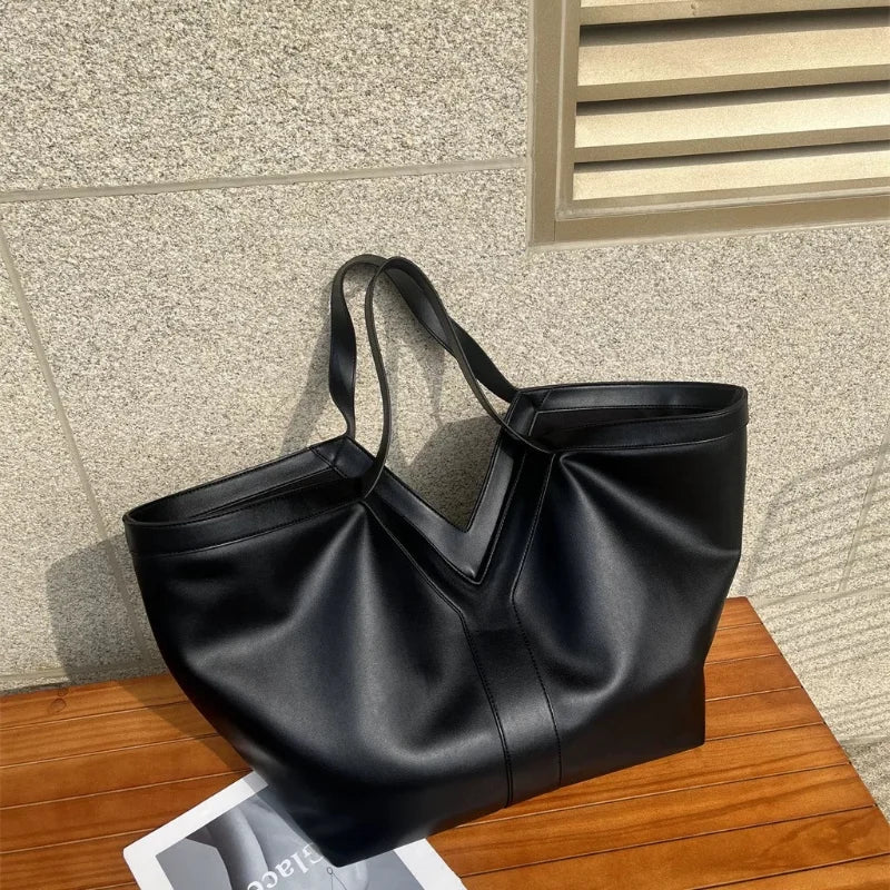 minimalist luxury shoulder bag with soft structure