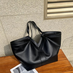 minimalist luxury shoulder bag with soft structure