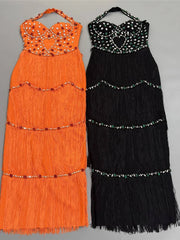 Black and orange beaded halter neck fringe dresses side by side