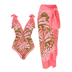 Pink and olive green palm leaf printed one-piece swimsuit with tie straps and a matching sarong.
