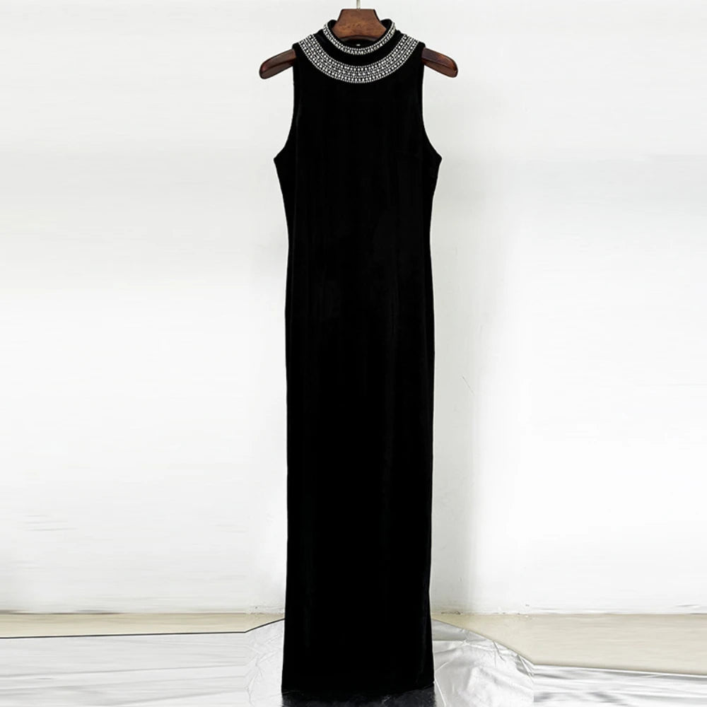 Black sleeveless dress with a decorative neckline on a wooden hanger against a white background.