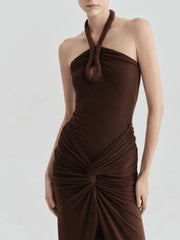 Close-up of halter neckline on brown ruched maxi dress