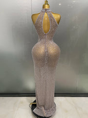 Silver beaded evening gown on a mannequin against a neutral background