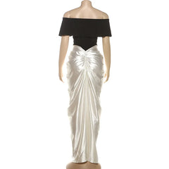 Mannequin wearing a black top and white ruched skirt- Back