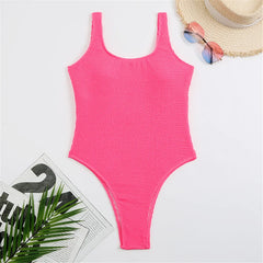 Pink ribbed high-cut one-piece swimwear laid flat